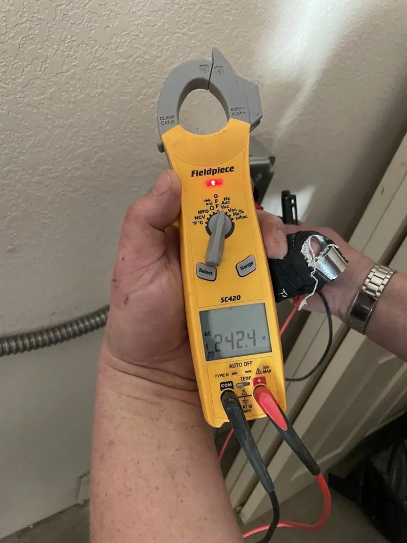 Voltage testing with clamp meter during Ceiling Fan Installation in Tysons